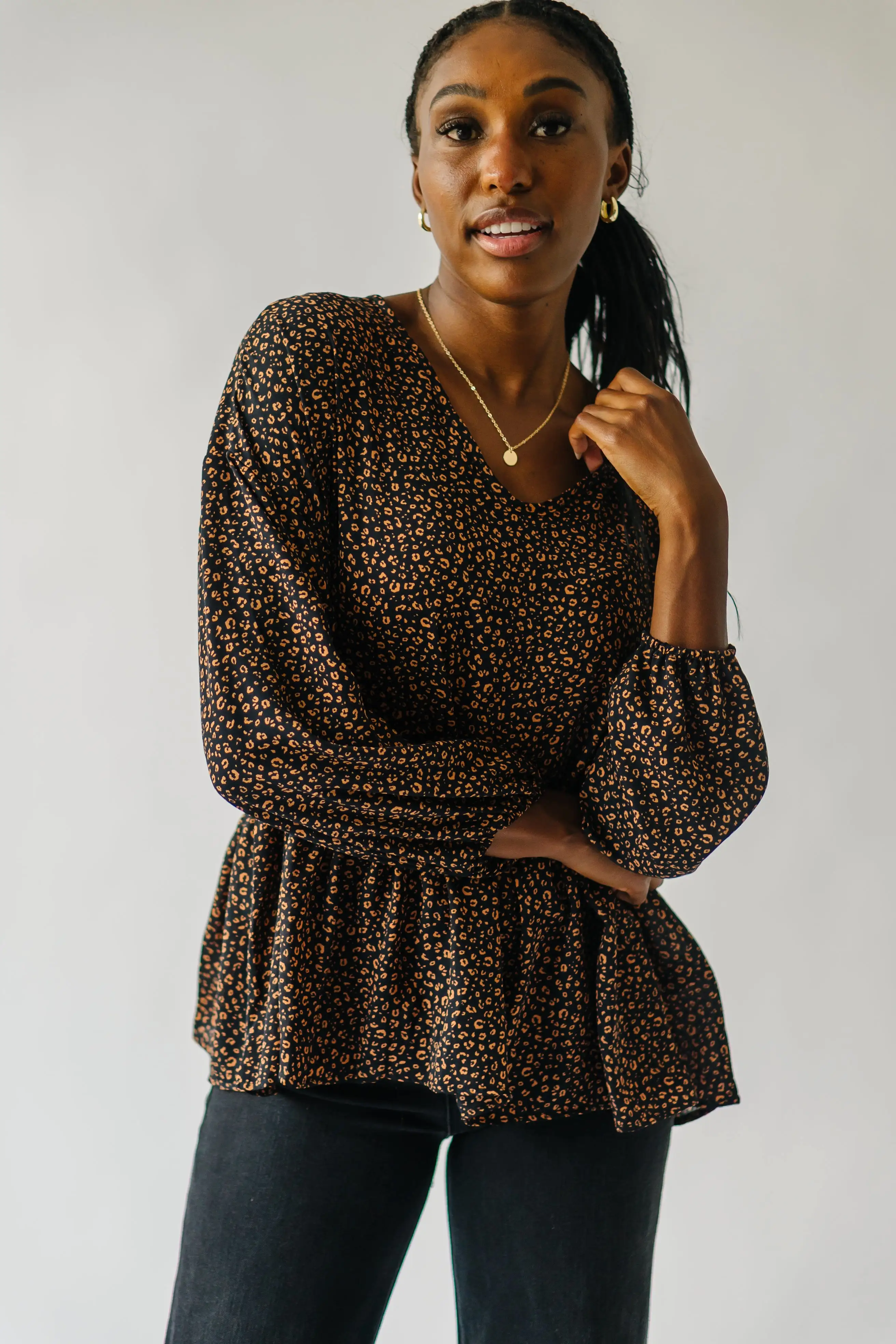 The Solana V-Neck Cheetah Peplum in Black + Terracotta