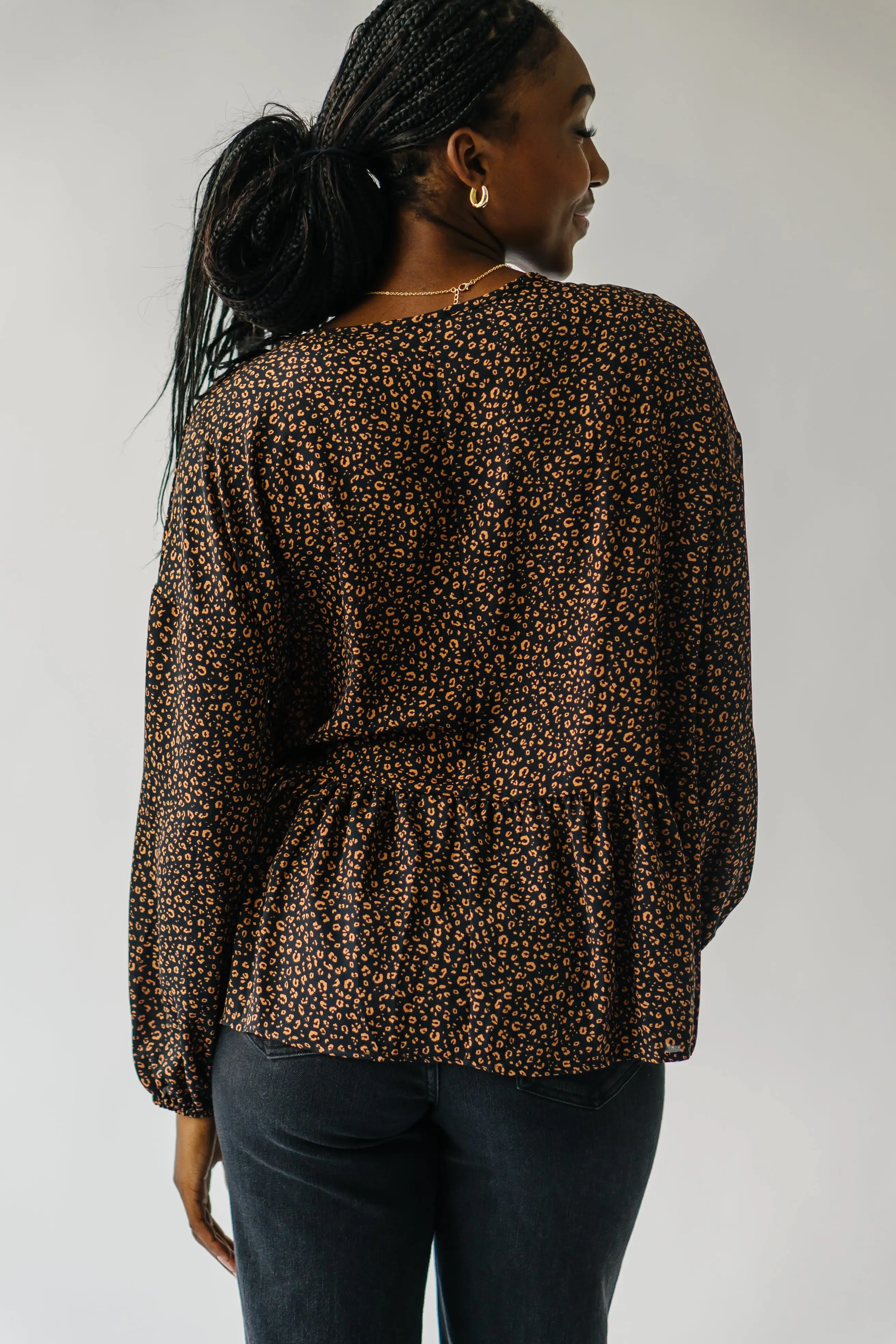 The Solana V-Neck Cheetah Peplum in Black + Terracotta